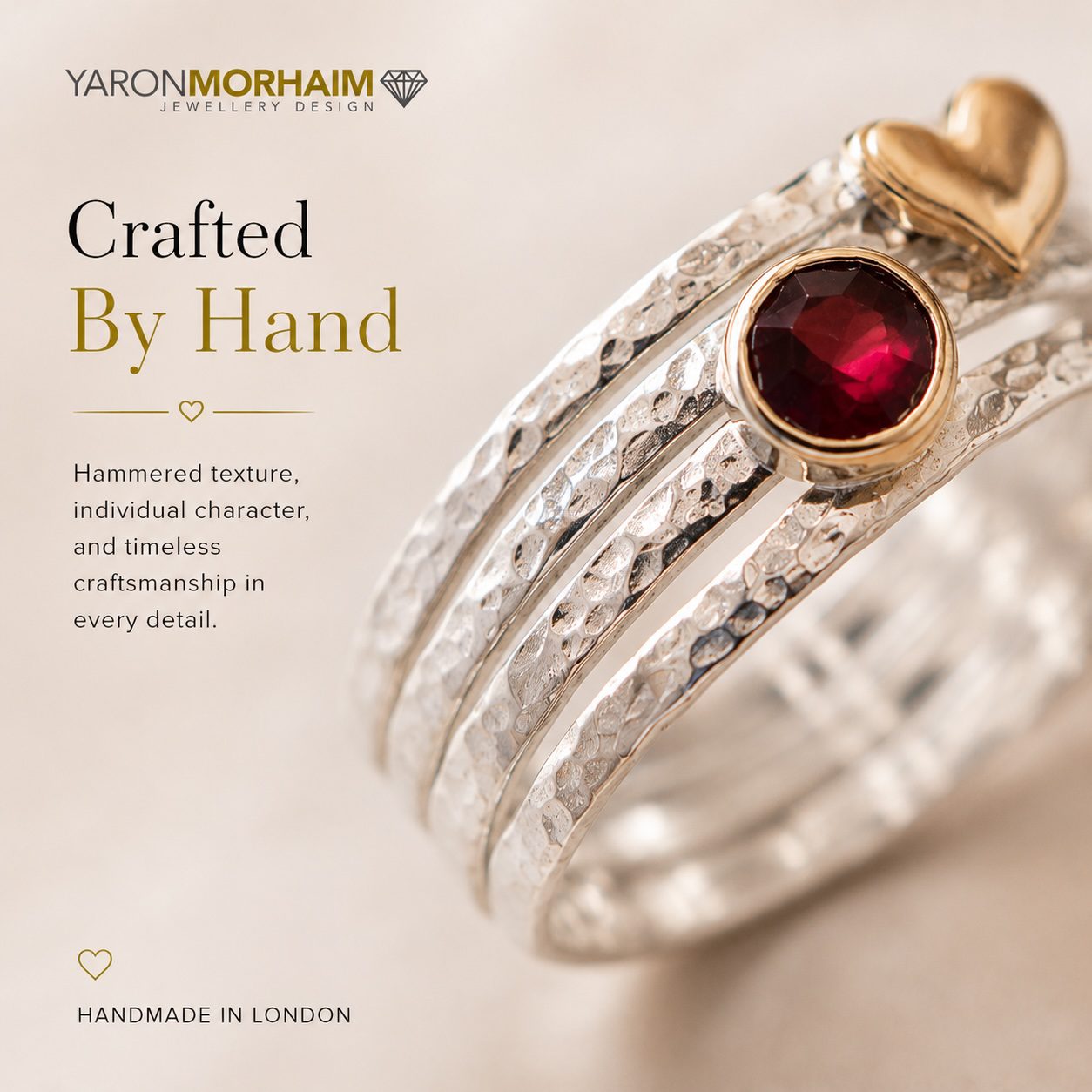 Sterling silver garnet ring with textured bands and natural red garnet gemstone
