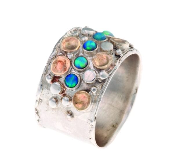 Dazzling silver and gold ring with gems