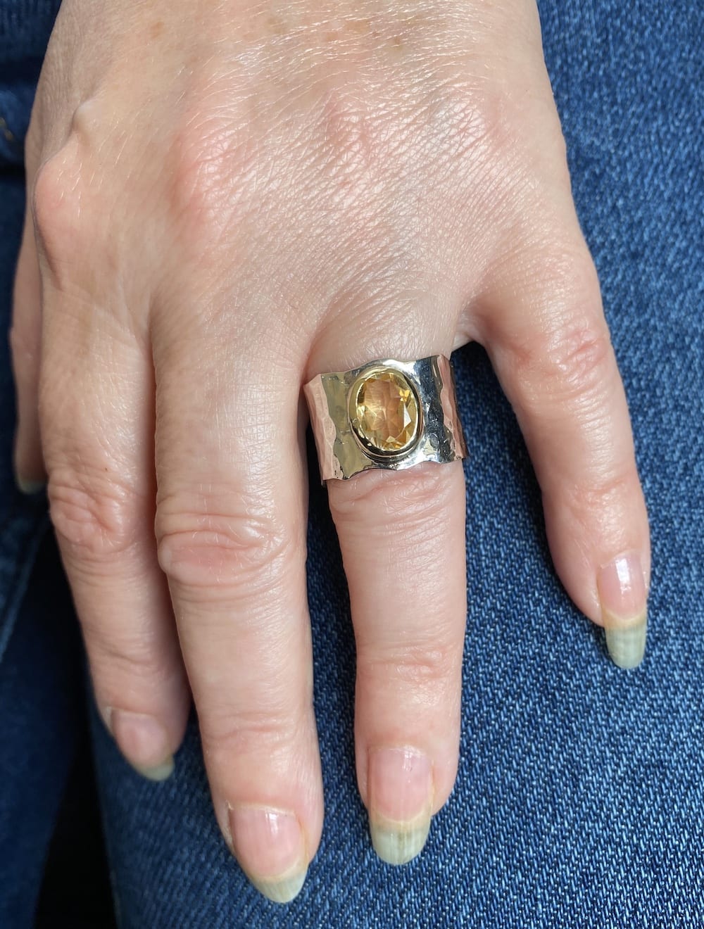 Citrine ring angled view showing golden tones and texture