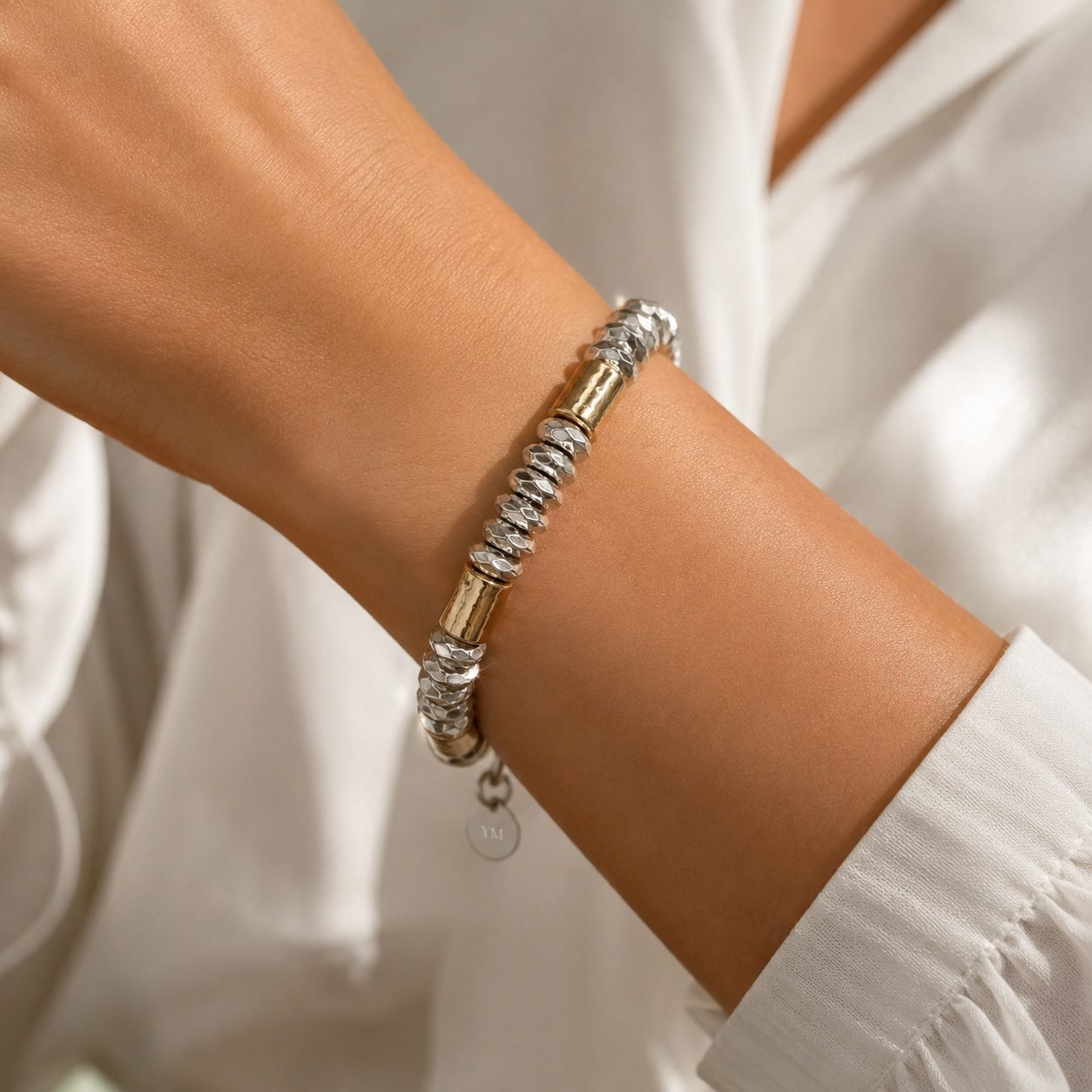 Luxury mixed metal bracelet handcrafted in sterling silver yellow gold and rose gold