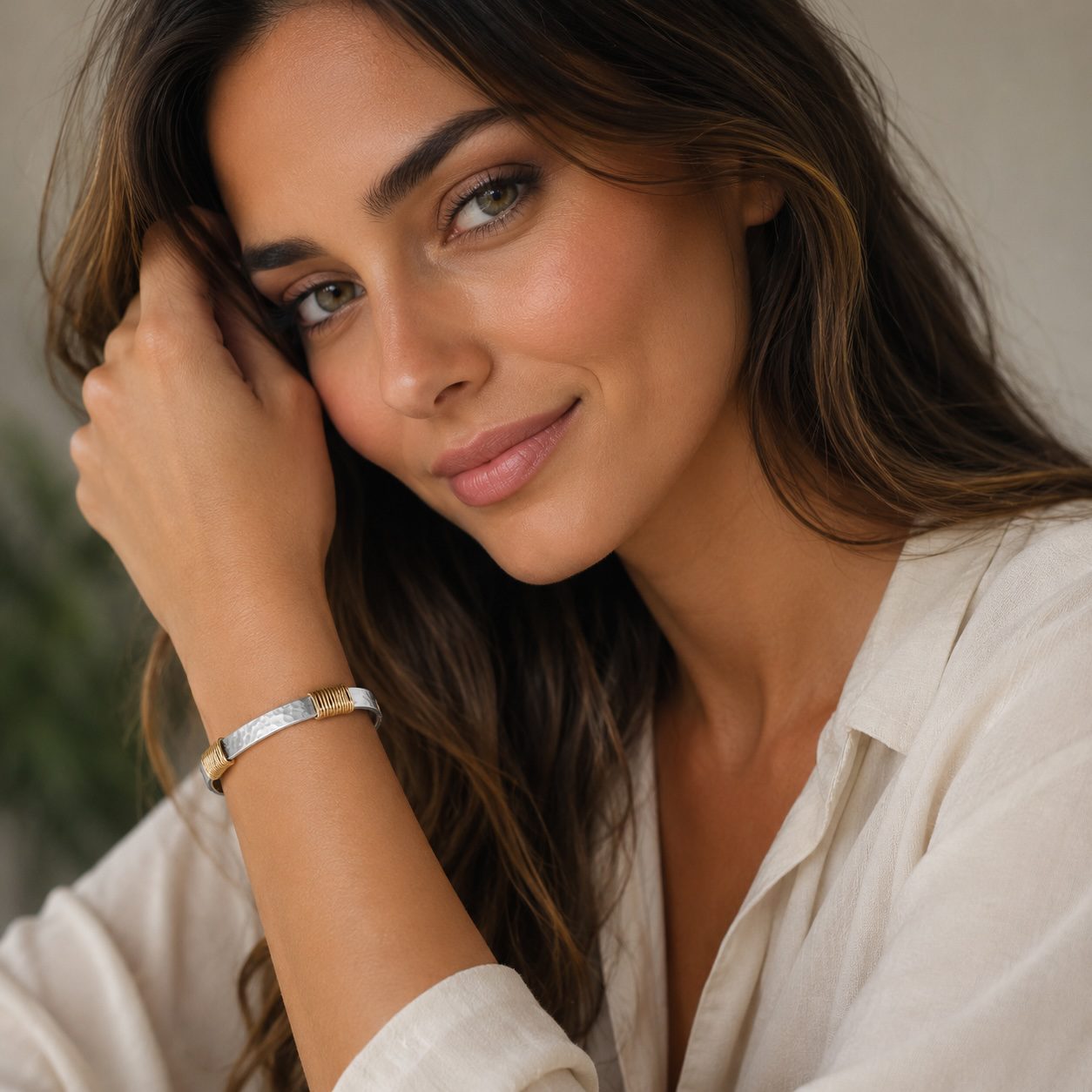 Female model wearing silver and gold hammered handcrafted bangle bracelet