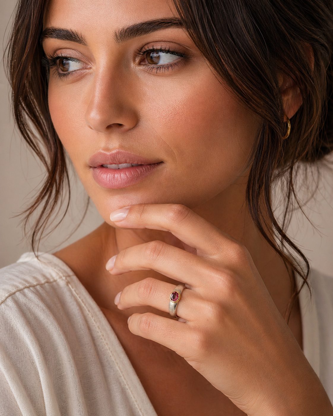 Luxury handcrafted silver and gold tourmaline ring worn on hand