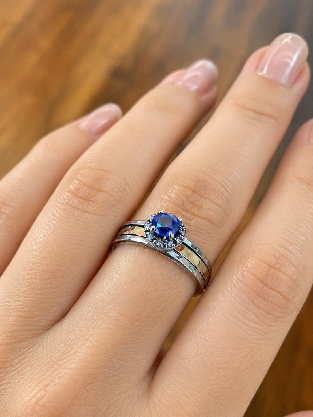 Luxury sapphire spinning ring worn on hand