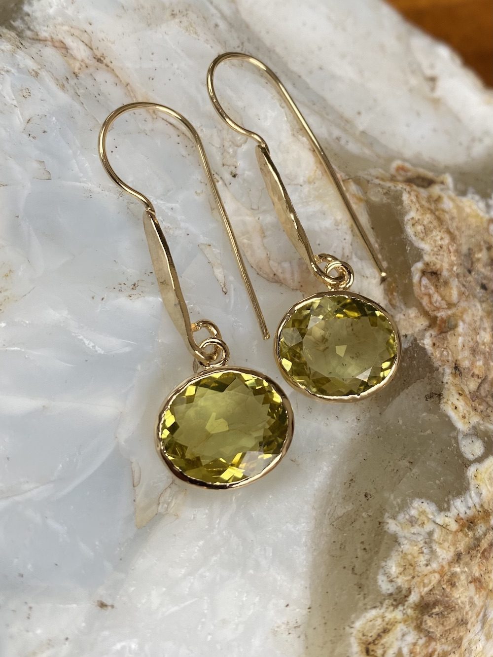 Handcrafted oval lemon quartz gemstone earrings in silver and gold
