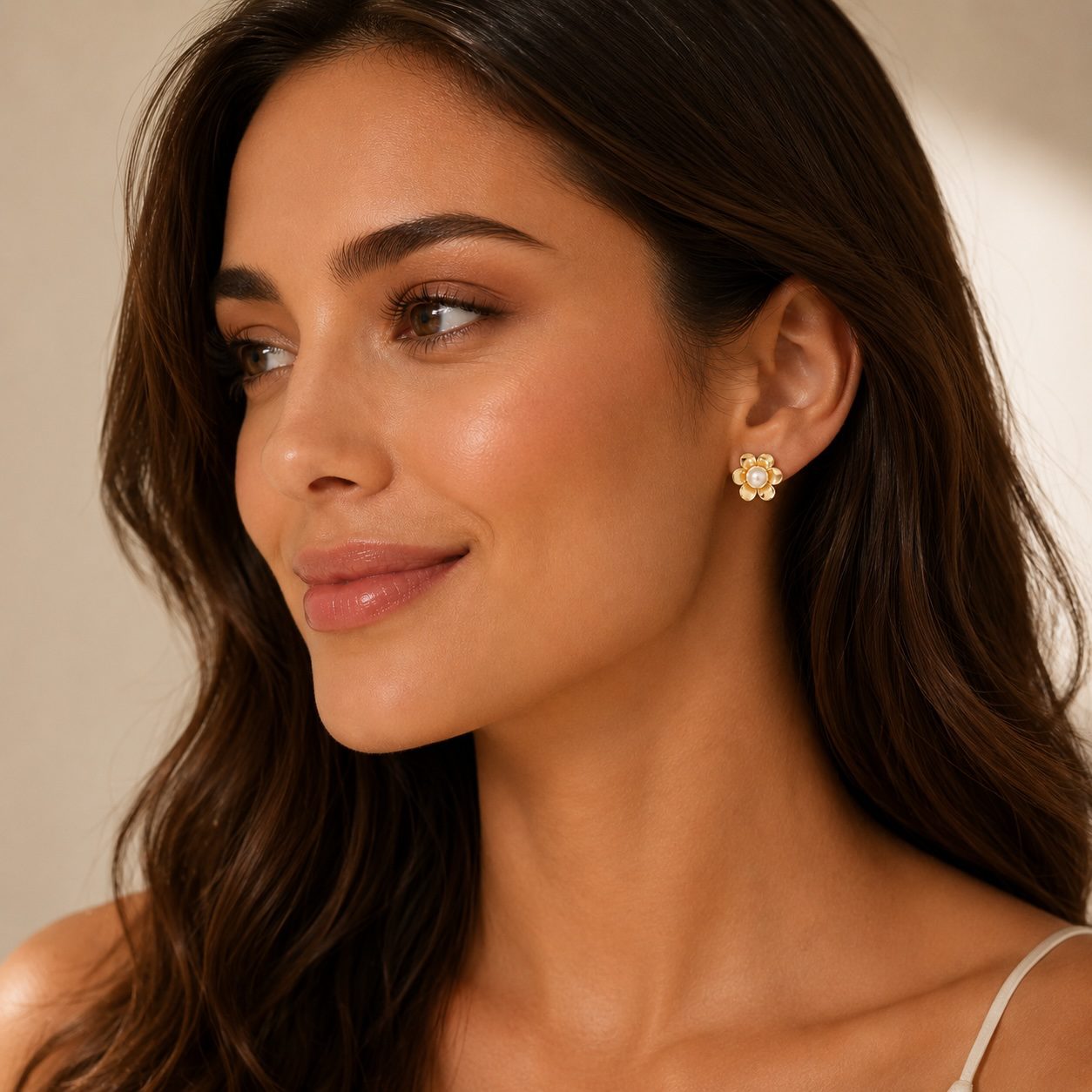 Handmade freshwater pearl stud earrings with golden tones