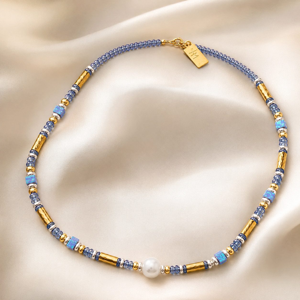 Close-up detail of Twilight Cascade necklace showing Tanzanite gemstones Opal accents and Baroque Pearl