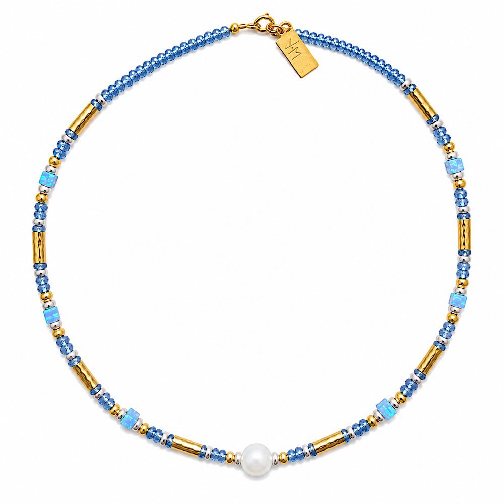 Woman wearing Twilight Cascade Tanzanite Necklace handcrafted with natural Tanzanite and Opal gemstones